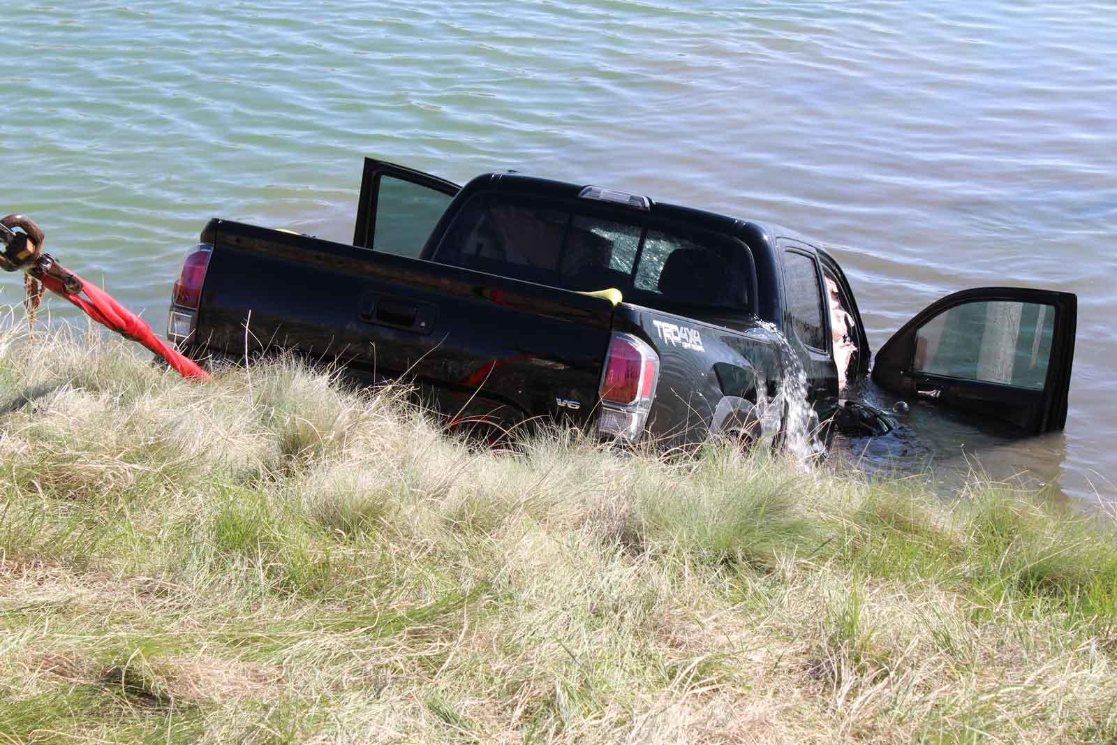 truck partially submerged in water