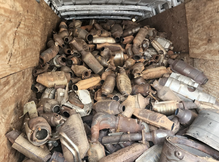 crate of used catalytic converters
